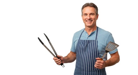 Man in apron holding tongs and spatula smiling on white background ready for grilling barbecue cookout