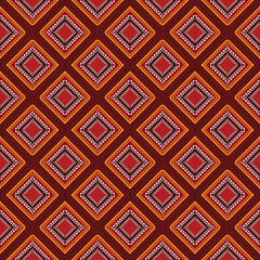Boho seamless pattern blends tribal floral design with a vivid red, orange, and gold palette