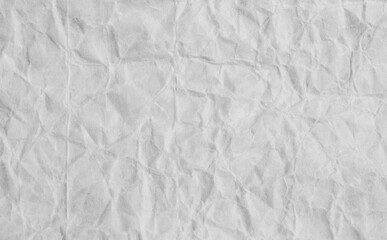 A sheet of white wrinkled glossy paper texture as background