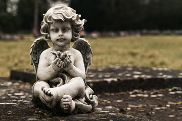Small angel figurine. Depressive style (concept of infant mortality)