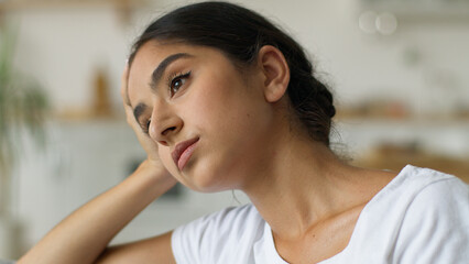 Arabian woman at home Indian female girl feeling headache pain anxiety bad mental health problem...