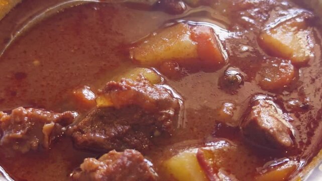 Hungarian Cuisine Concept. Traditional goulash meat soup close up. . High quality 4k footage