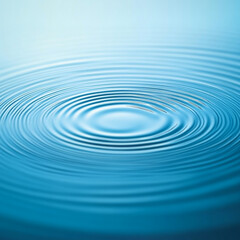 Rippling water surface creating circular patterns in tranquil blue  