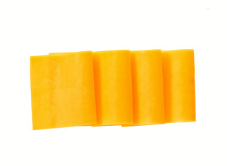 pieces of red cheddar cheese isolated on a white background. tasty cheddar cheese isolated, top view.