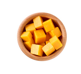 cheddar cheese sliced ​​into cubes in a wooden bowl isolated on a white background, top view.