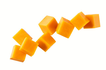 Cubes of cheddar cheese falling isolated on a white background, top view.