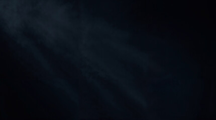 Obraz premium Abstract smoky texture with dark tones and soft light diffusion on black background