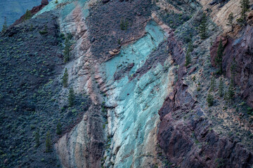 Colorful Erosion Patterns on Mountain Slope with Sparse Vegetation