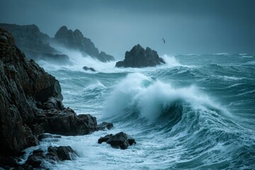 Fototapeta premium Ocean surge crashing rocky coast; moody, stormy seascape with crashing waves and coastal rocks against a cloudy sky