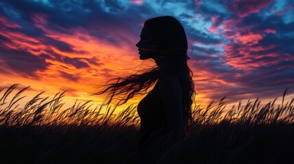 Silhouette of a woman at sunset (1)