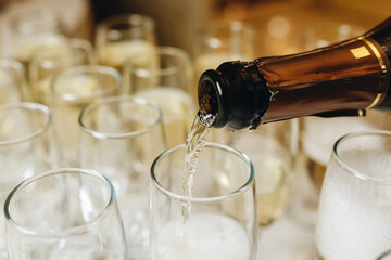 Champagne Pouring into Glasses for Celebration