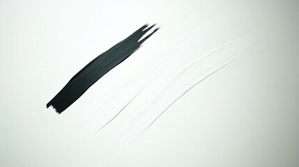 Abstract composition of black and white paint strokes on a plain background
