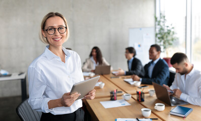 Successful Businesswoman HR Holding Digital Tablet Smiling To Camera Standing Near Desk With...
