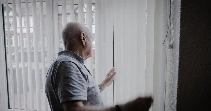 Retirement, man and window hand wave with smile for friendly, happy and neighbourhood greeting. Elderly, pensioner and happiness of senior citizen at home in Australia waving hello at blinds.
