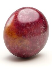 Fototapeta premium A single ripe plum with reddish-purple skin and subtle orange hues sits isolated on a pure white background.