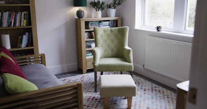 Armchair, sofa or furniture in relax home library, living room or psychology counseling clinic in mental health, stress management or self care. Empty room, couch or lounge seat in counseling therapy