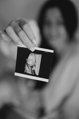 Expecting Joy: A Woman Holding an Ultrasound Photo