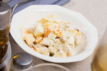 Delicious salad with chicken fillet, pineapple and eggs, dressed with yogurt sauce