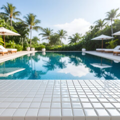 Fototapeta premium Empty white ceramic mosaic table top and blurred swimming pool in tropical resort in summer banner background - can used for display or montage your products.