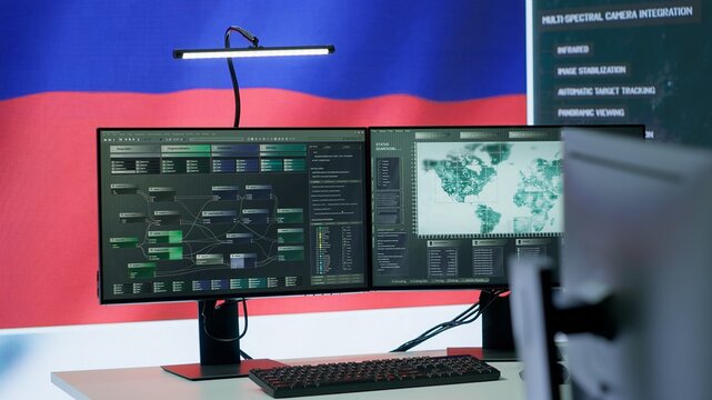 Empty russian military control center with a big screen presenting the national flag, spreading fake news and propaganda to brainwash the people. Inflicting fear among the population. Camera A. - Powered by Adobe