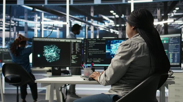 Data center employee deploying AI solutions optimizing equipment. Server farm software developer applying artificial intelligence technology minimizing infrastructure downtime, camera A