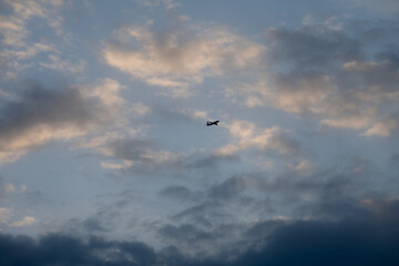 A plane about to land on a spring evening