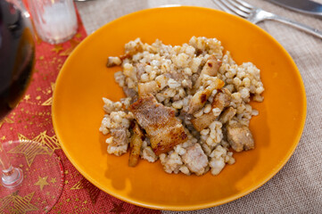 Delicious serving of barley porridge with lard served beautifully