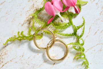 Gold Hoop Earrings and Jewelry with Bleeding Heart Flowers Flatlay
