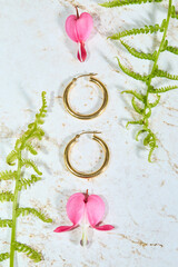 Gold Hoop Earrings and Jewelry with Bleeding Heart Flowers Flatlay
