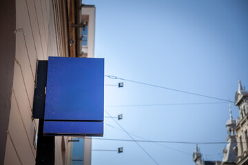 Blank Empty blue rectangular store sign on a shop in Croatia, empty and ready for customized advertising or business branding.