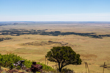 Serene landscape of the volcanic field seen from Crater Rim Trail at Capulin Volcano National Monument. Smoke in background is from wildfires at the time.