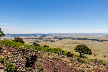 Serene landscape of the volcanic field seen from Crater Rim Trail at Capulin Volcano National Monument. 