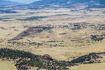 Serene landscape of the volcanic field seen from Crater Rim Trail at Capulin Volcano National Monument. 