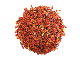 Pile of red chili pepper flakes isolated on white, top view