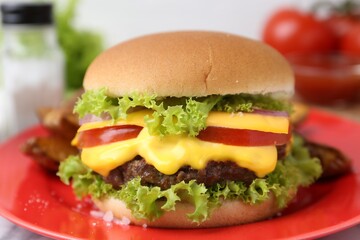 Tasty cheeseburger with lettuce and tomatoes on white table, closeup