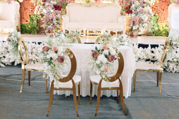 Elegant Wedding Ceremony Decor  Gold Chairs White Table Pink Flowers