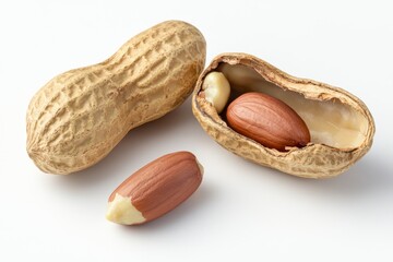 Whole and broken peanuts on a white background