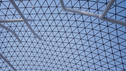Geometric Grid Structure Against Blue Sky, Abstract Architectural Design