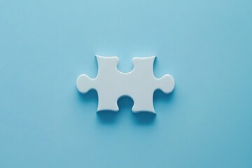 Obraz premium Single white puzzle piece on light blue background