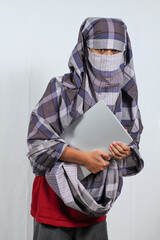 thief carrying white laptop walking stealthily isolated on white background