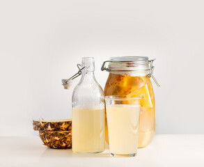  Tepache, fermented mexican pineapple drink, in a glass jar, selective focus