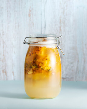  Tepache, fermented mexican pineapple drink, in a glass jar, selective focus
