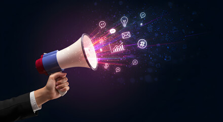 Hand Holding a Megaphone with Digital Icons and Data Representing Digital Marketing and Online Communication