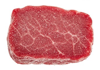 Fototapeta premium A raw steak covered in salt isolated on white background