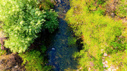 A view of a valley in early summer colored with green light. A beautiful natural view of Sillim, Gangwon Province, Korea's attraction, taken with a drone in the sky. A trip to Gangwon Province