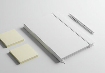 Clean overhead arrangement of white notepaper mockup pen and sticky notes for office or education use