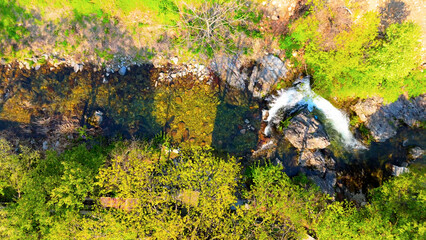 A view of a valley in early summer colored with green light. A beautiful natural view of Sillim, Gangwon Province, Korea's attraction, taken with a drone in the sky. A trip to Gangwon Province
