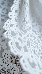 close up of a white lace on a piece of cloth