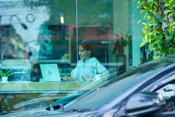 senior women using laptop working, senior owner with laptop business finance