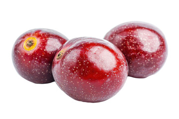Fototapeta premium Close-up view of three whole passion fruits, brilliantly colored and glossy, presented against a plain background. They are stacked slightly.